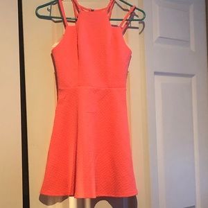 Neon pink dress with ladder strapping in the back
